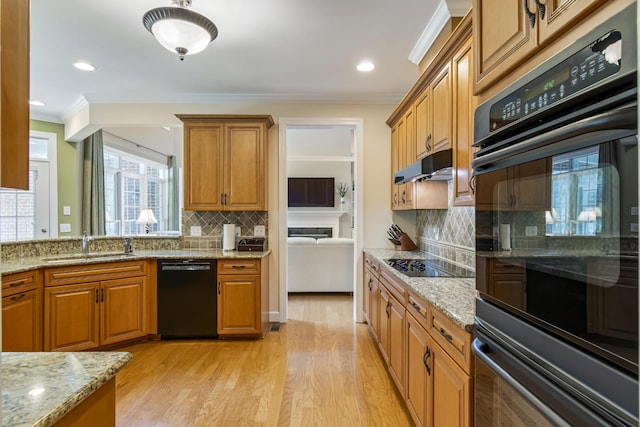 9166 Sydney Ln, Brentwood, TN 37027 - kitchen featuring black appliances, crown molding, a sink, brown cabinets, and decorative backsplash