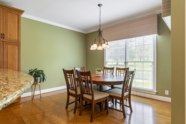 9166 Sydney Ln, Brentwood, TN 37027 - dining space featuring a chandelier, crown molding, baseboards, and light wood finished floors