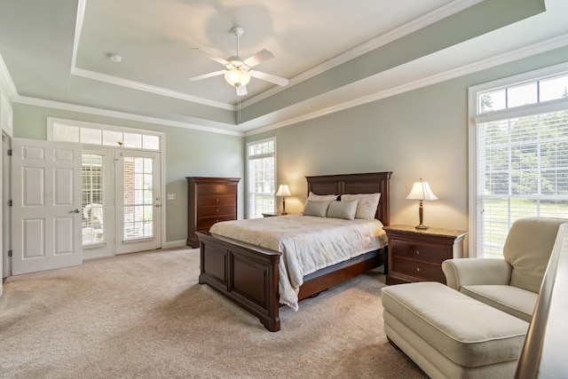 9166 Sydney Ln, Brentwood, TN 37027 - bedroom featuring access to exterior, multiple windows, a tray ceiling, light carpet, and ornamental molding