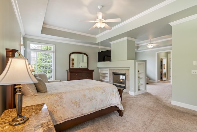 9166 Sydney Ln, Brentwood, TN 37027 - carpeted bedroom featuring a raised ceiling, crown molding, a tiled fireplace, baseboards, and a ceiling fan
