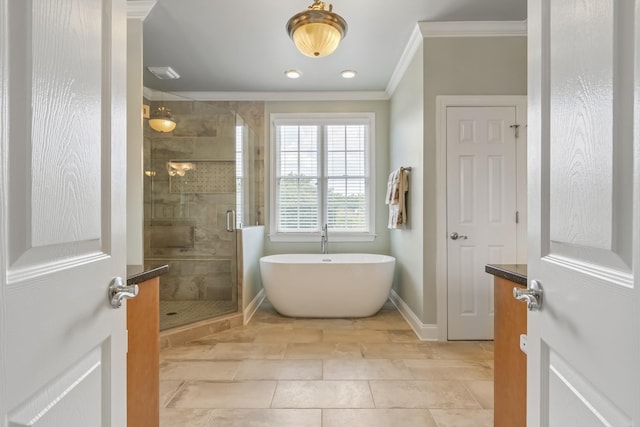 9166 Sydney Ln, Brentwood, TN 37027 - bathroom featuring ornamental molding, a soaking tub, a stall shower, baseboards, and tile patterned floors