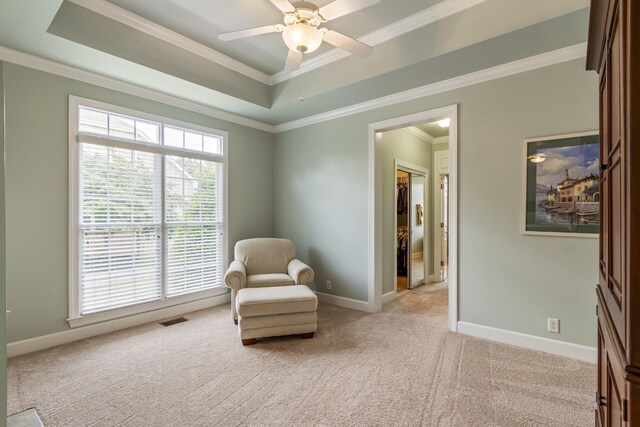 9166 Sydney Ln, Brentwood, TN 37027 - living area with light carpet, a tray ceiling, crown molding, healthy amount of natural light, and baseboards