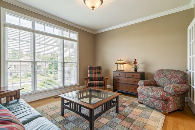 9166 Sydney Ln, Brentwood, TN 37027 - living room featuring crown molding, light wood-style flooring, and baseboards