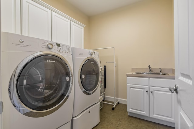 9166 Sydney Ln, Brentwood, TN 37027 - washroom featuring separate washer and dryer, cabinet space, light tile patterned flooring, and baseboards