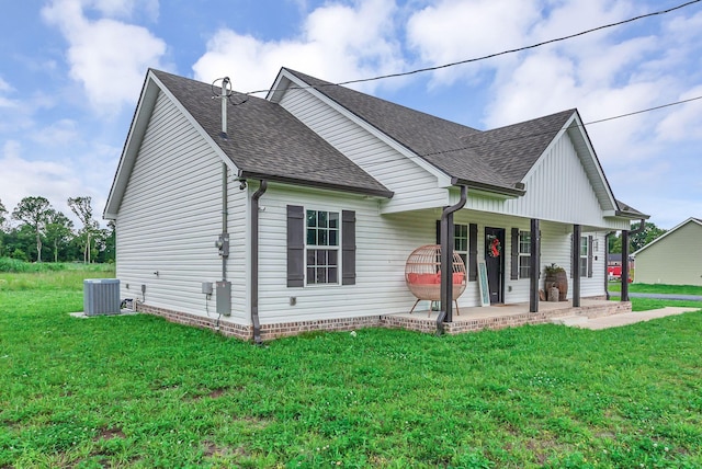 241 Holly Grove Rd, Lewisburg, TN 37091 - view of front facade with roof with shingles, a front lawn, and central air condition unit