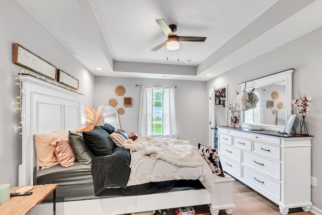 241 Holly Grove Rd, Lewisburg, TN 37091 - bedroom with light wood-style flooring, a raised ceiling, baseboards, and ceiling fan