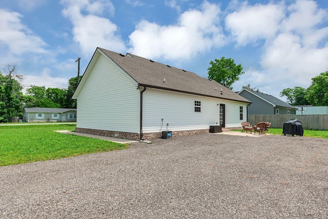 241 Holly Grove Rd, Lewisburg, TN 37091 - rear view of property with a patio area and roof with shingles