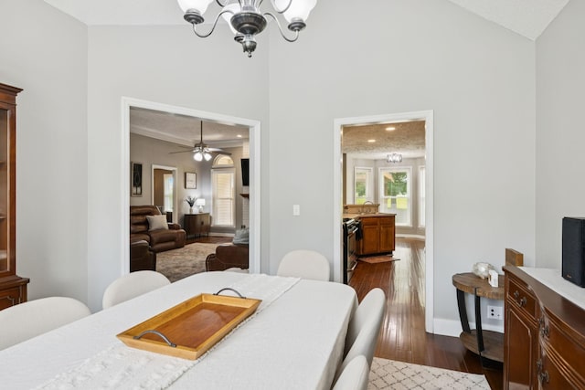 2754 Douglas Ln, Thompsons Station, TN 37179 - dining room with dark wood finished floors, a chandelier, high vaulted ceiling, and ceiling fan