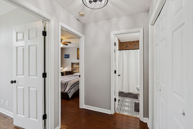 2754 Douglas Ln, Thompsons Station, TN 37179 - hallway featuring baseboards, dark wood-style flooring, and a textured ceiling