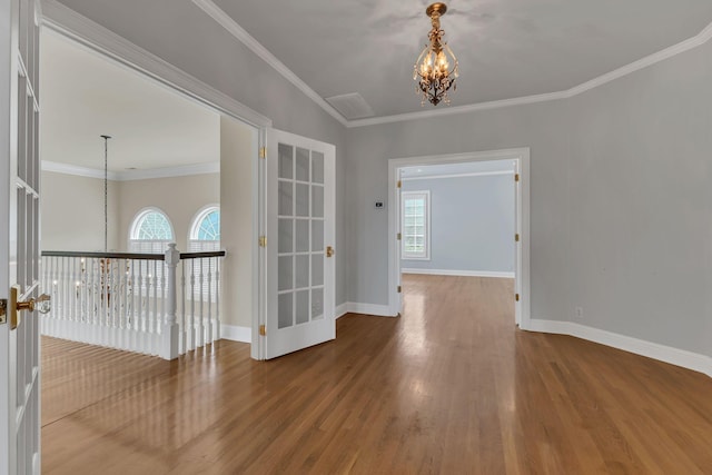 113 Middleton Cir, Nashville, TN 37215 - empty room featuring a chandelier, wood finished floors, baseboards, and crown molding