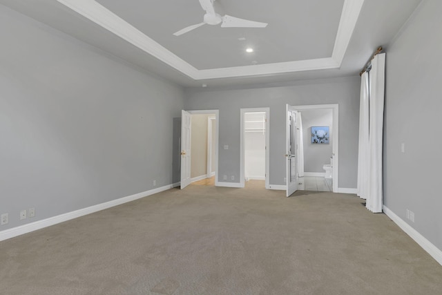 113 Middleton Cir, Nashville, TN 37215 - unfurnished bedroom featuring a raised ceiling, light colored carpet, a spacious closet, baseboards, and ensuite bath