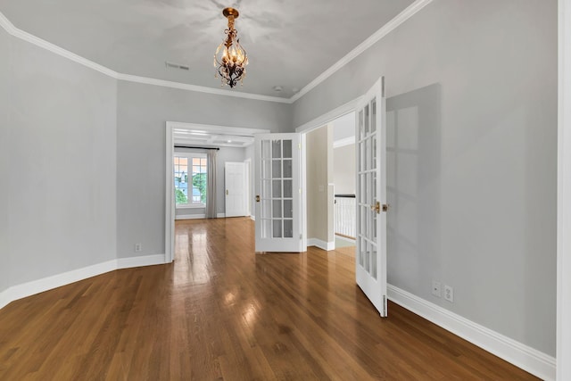 113 Middleton Cir, Nashville, TN 37215 - unfurnished room with french doors, a chandelier, wood finished floors, baseboards, and crown molding