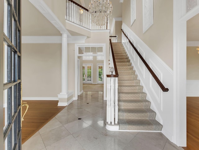 113 Middleton Cir, Nashville, TN 37215 - foyer with a towering ceiling, stairs, a chandelier, crown molding, and baseboards
