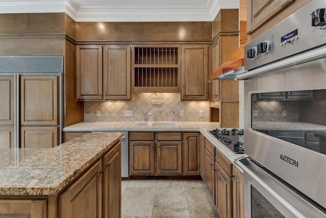 113 Middleton Cir, Nashville, TN 37215 - kitchen featuring a sink, black gas stovetop, ornamental molding, decorative backsplash, and brown cabinets