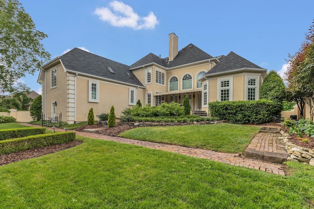 113 Middleton Cir, Nashville, TN 37215 - back of house featuring a chimney and stucco siding