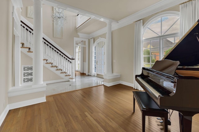 113 Middleton Cir, Nashville, TN 37215 - entryway with decorative columns, baseboards, stairs, crown molding, and wood finished floors