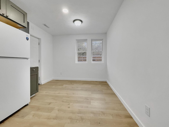 109 Daniel St, Waverly, TN 37185 - unfurnished dining area with light wood finished floors and baseboards