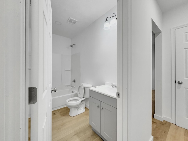 109 Daniel St, Waverly, TN 37185 - full bath featuring wood finished floors, toilet, vanity, and  shower combination