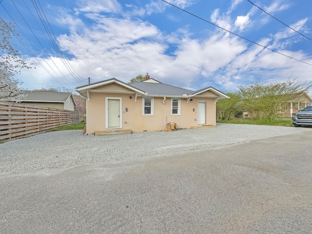 109 Daniel St, Waverly, TN 37185 - bungalow-style home with stucco siding, driveway, and metal roof
