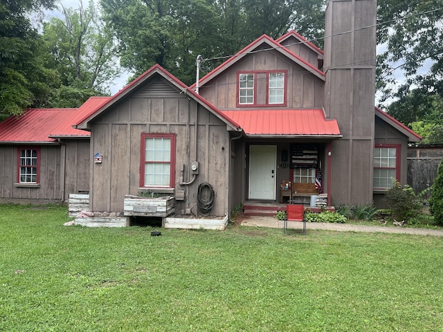 525 Inver Ln, Clarksville, TN 37042 - view of front of property with metal roof, a front yard, a chimney, and board and batten siding