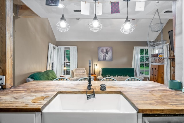 525 Inver Ln, Clarksville, TN 37042 - kitchen featuring wood counters, a sink, lofted ceiling, open floor plan, and stainless steel dishwasher
