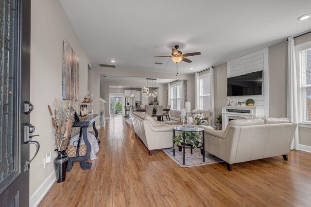 5190 Giardino Dr, Mount Juliet, TN 37122 - living room with light wood-style floors, ceiling fan, a fireplace, and recessed lighting