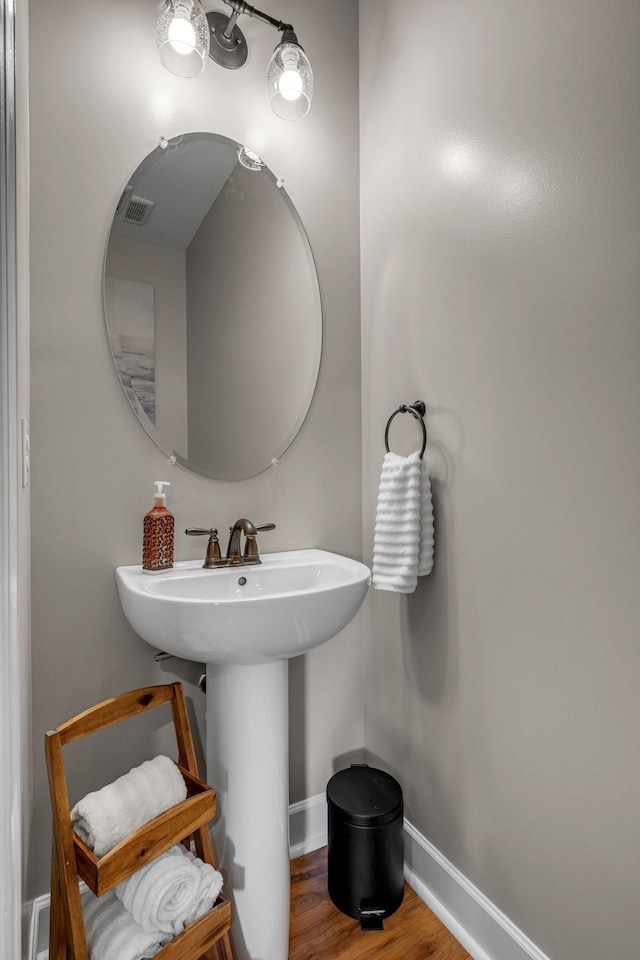 5190 Giardino Dr, Mount Juliet, TN 37122 - bathroom featuring baseboards, wood finished floors, and a sink