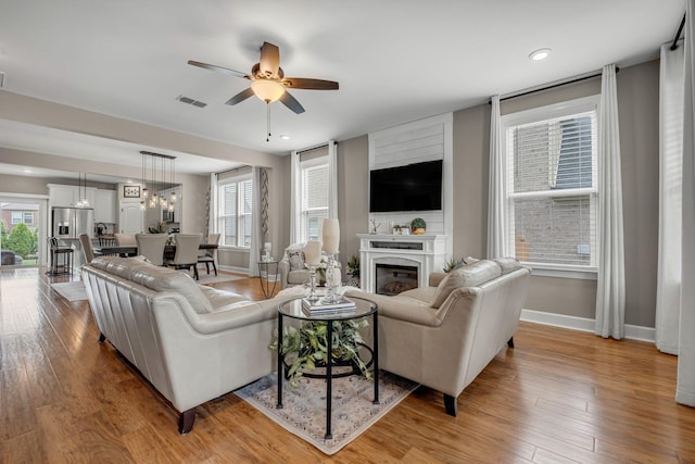 5190 Giardino Dr, Mount Juliet, TN 37122 - living room with baseboards, a ceiling fan, wood finished floors, healthy amount of natural light, and recessed lighting