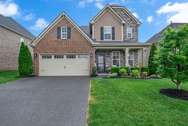 5190 Giardino Dr, Mount Juliet, TN 37122 - view of front of property featuring asphalt driveway, a front yard, a garage, stone siding, and covered porch