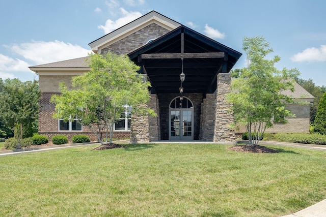 5190 Giardino Dr, Mount Juliet, TN 37122 - craftsman house with french doors, a front lawn, brick siding, and stone siding