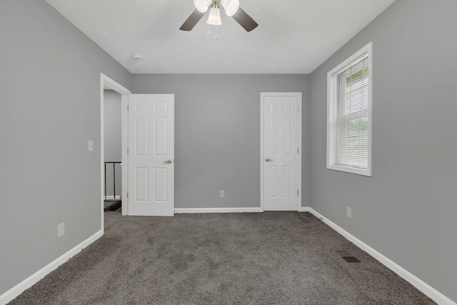3728 Wharton Dr, Nashville, TN 37211 - unfurnished bedroom featuring dark colored carpet, baseboards, and ceiling fan