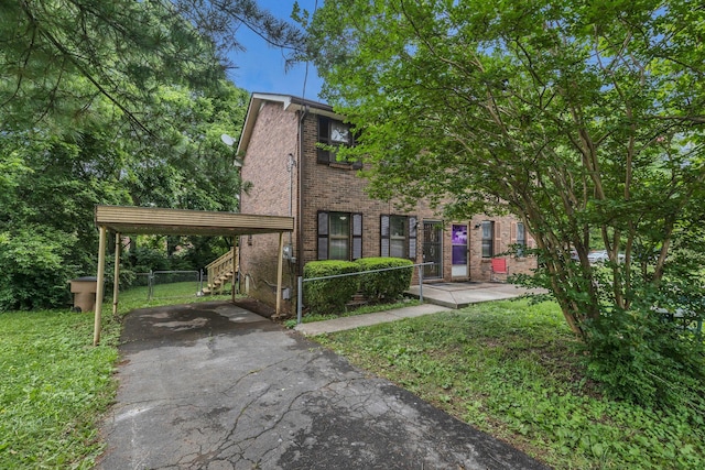 3728 Wharton Dr, Nashville, TN 37211 - view of front of house featuring brick siding, asphalt driveway, and a detached carport