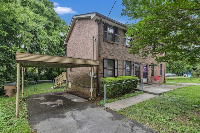 3728 Wharton Dr, Nashville, TN 37211 - view of front of house featuring brick siding, a carport, and driveway