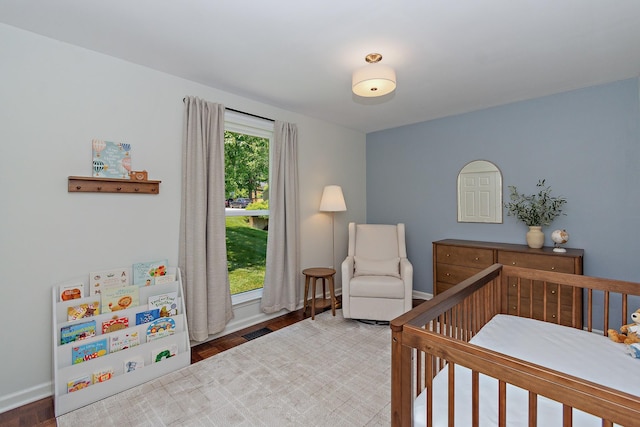 600 Riverview Dr, Franklin, TN 37064 - bedroom featuring a crib, baseboards, and wood finished floors