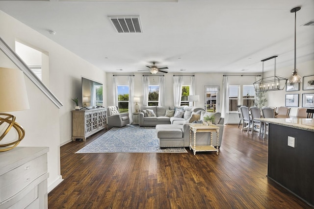 6013 Doster Rd, Smyrna, TN 37167 - living area featuring healthy amount of natural light, dark wood-style floors, a ceiling fan, and a chandelier