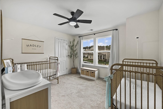 6013 Doster Rd, Smyrna, TN 37167 - bedroom featuring light carpet, baseboards, a ceiling fan, and a nursery area