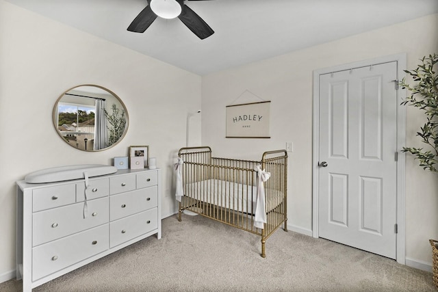 6013 Doster Rd, Smyrna, TN 37167 - bedroom with a crib, light carpet, baseboards, and ceiling fan