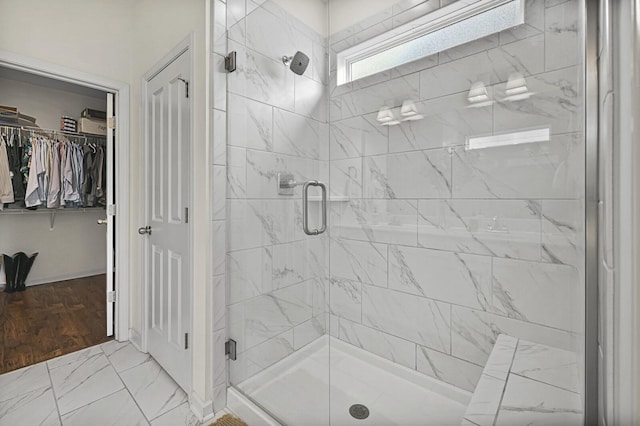 6013 Doster Rd, Smyrna, TN 37167 - full bathroom with a shower stall, a spacious closet, and marble look tiles