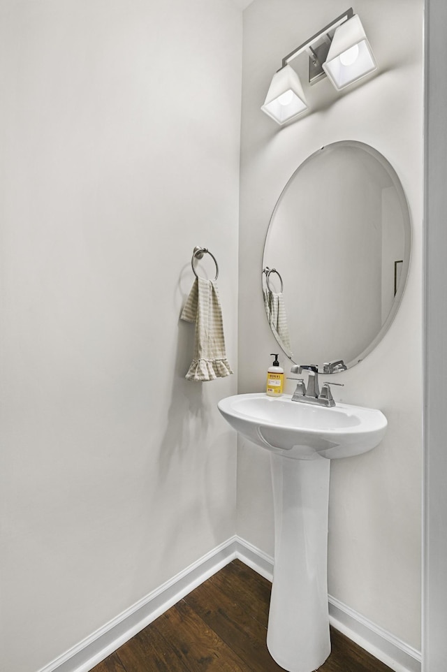 6013 Doster Rd, Smyrna, TN 37167 - bathroom featuring baseboards, wood finished floors, and a sink