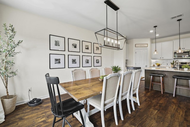 6013 Doster Rd, Smyrna, TN 37167 - dining room featuring dark wood-type flooring, recessed lighting, baseboards, and a chandelier