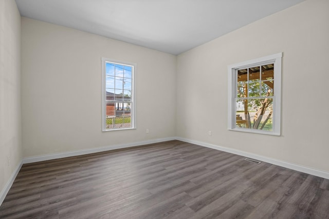 1601 S Willow St, Chattanooga, TN 37404 - spare room featuring plenty of natural light, dark wood-type flooring, and baseboards