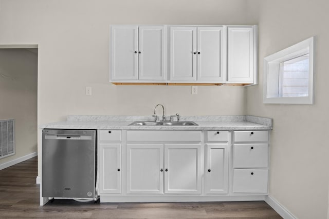 1601 S Willow St, Chattanooga, TN 37404 - kitchen featuring dishwasher, a sink, and white cabinets