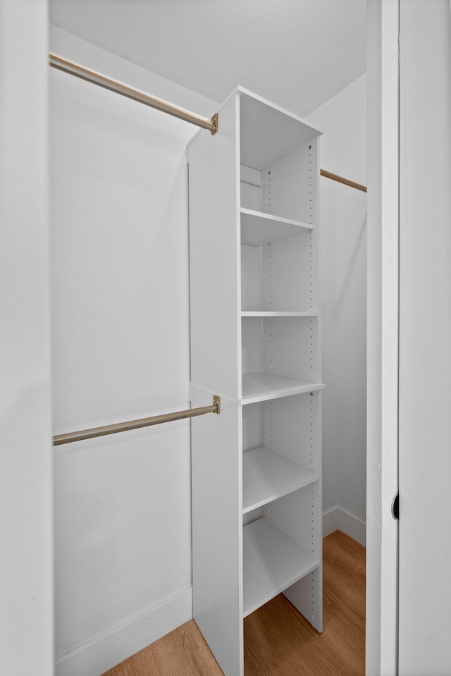 116 31st Ave N Unit 104, Nashville, TN 37203 - spacious closet featuring wood finished floors
