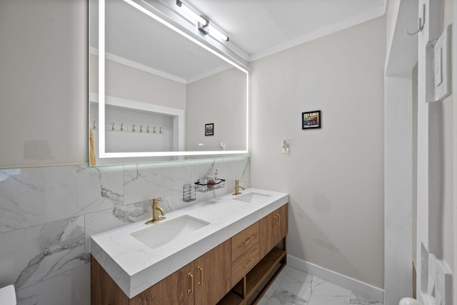 116 31st Ave N Unit 104, Nashville, TN 37203 - full bath with double vanity, marble finish floors, ornamental molding, and decorative backsplash