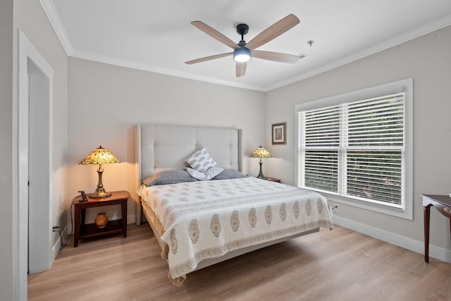 116 31st Ave N Unit 104, Nashville, TN 37203 - bedroom with light wood-type flooring, ornamental molding, and ceiling fan