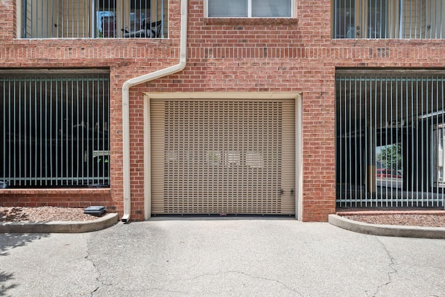 116 31st Ave N Unit 104, Nashville, TN 37203 - doorway to property with brick siding and driveway