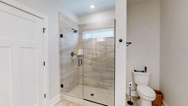 1137 Fiona Dr, Lebanon, TN 37087 - bathroom with toilet, baseboards, and a shower stall