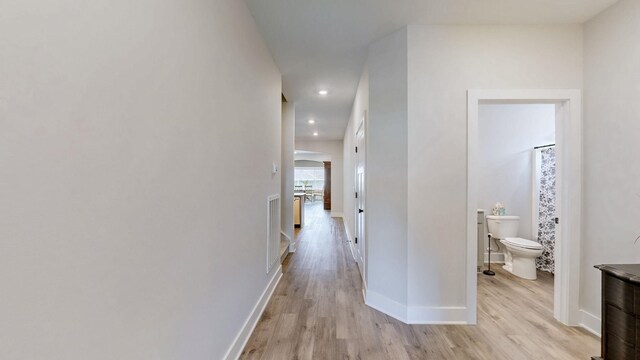 1137 Fiona Dr, Lebanon, TN 37087 - hallway with light wood finished floors, recessed lighting, and baseboards