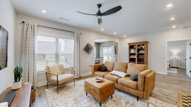 1137 Fiona Dr, Lebanon, TN 37087 - living area with arched walkways, a ceiling fan, light wood-style flooring, baseboards, and recessed lighting