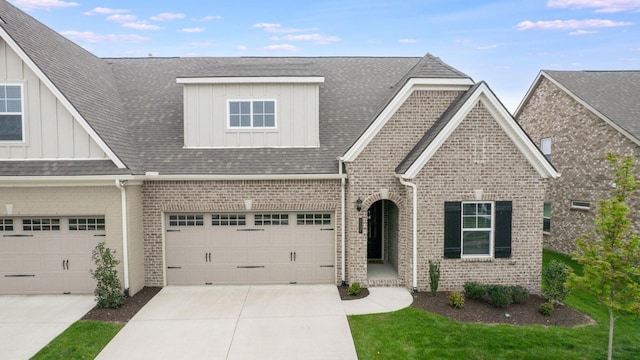 1137 Fiona Dr, Lebanon, TN 37087 - view of front of house featuring board and batten siding, brick siding, concrete driveway, a garage, and a shingled roof